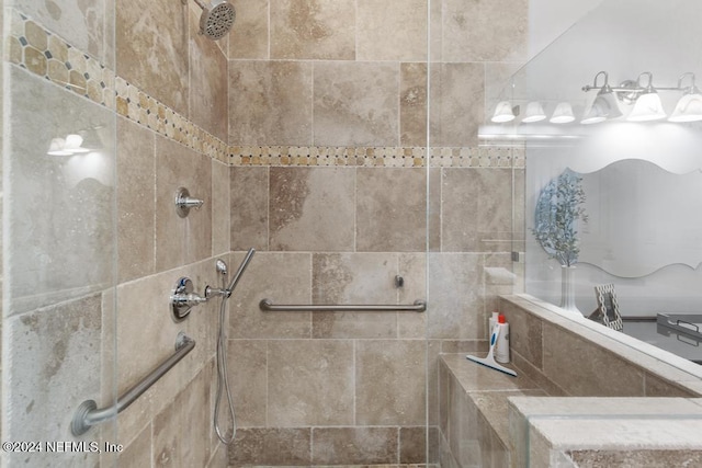 bathroom with a tile shower