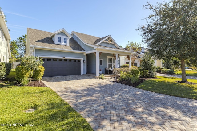 view of front of property with covered porch and a front lawn