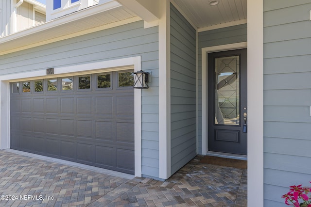 property entrance with a garage