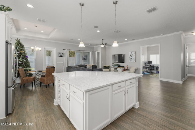 kitchen with white cabinets, dark hardwood / wood-style floors, a center island, and hanging light fixtures