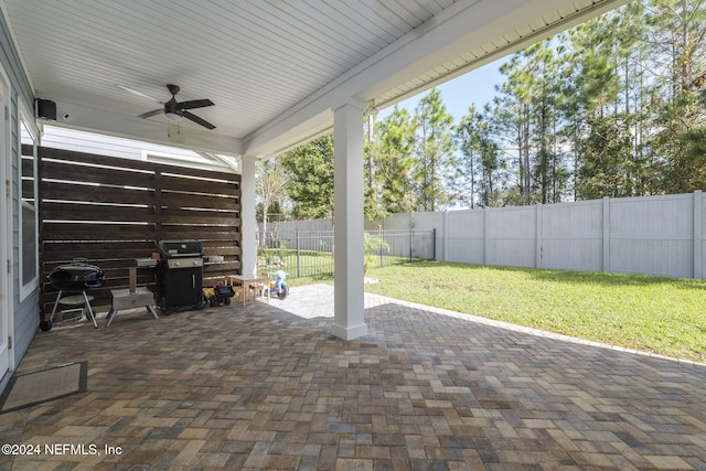 view of patio / terrace with ceiling fan and a grill