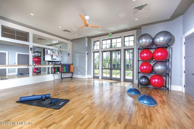 exercise area with ceiling fan, wood-type flooring, and french doors