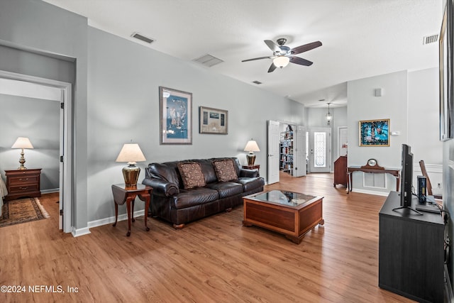 living room with ceiling fan and light hardwood / wood-style floors