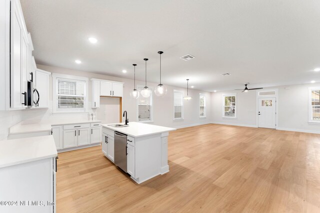 kitchen featuring dishwasher, a center island with sink, white cabinets, and light hardwood / wood-style flooring