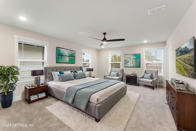 bedroom with ceiling fan and light colored carpet