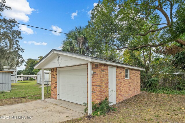 garage featuring a yard