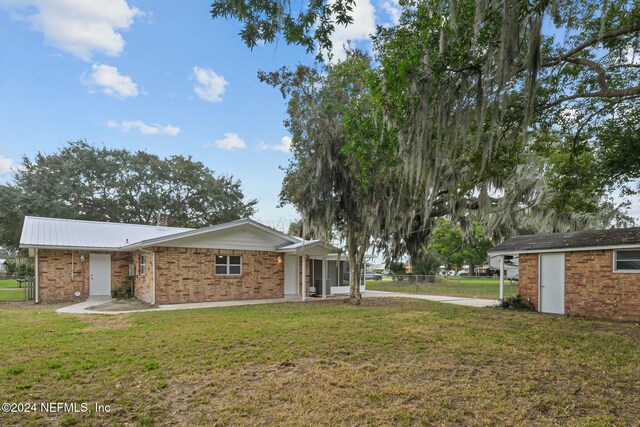 exterior space with a front lawn