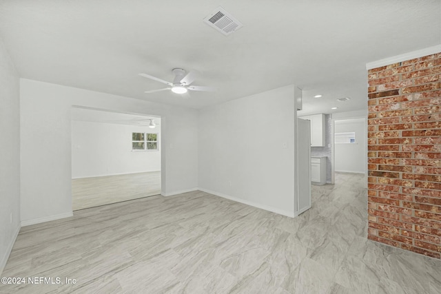 spare room featuring ceiling fan