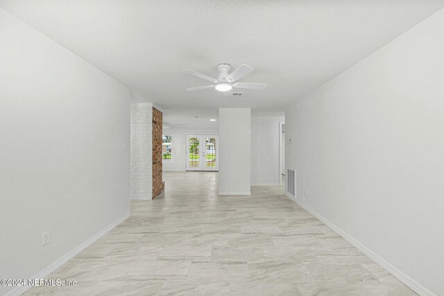 hallway with a textured ceiling