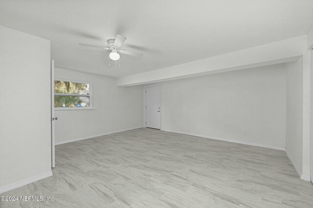 spare room featuring ceiling fan