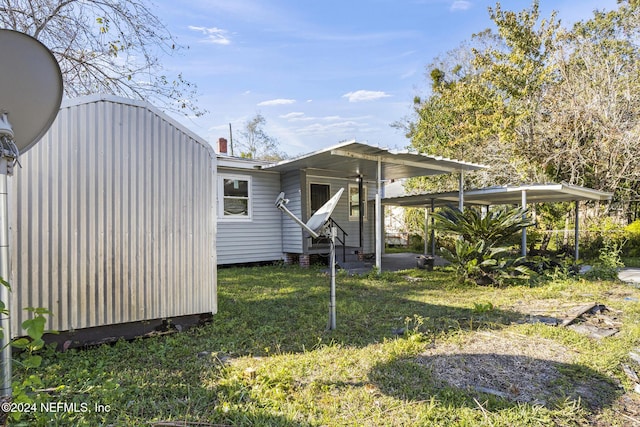 rear view of house with a yard