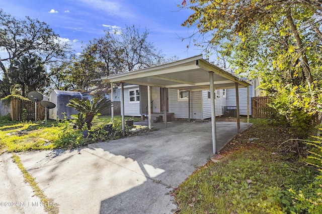 view of front of property with a storage unit