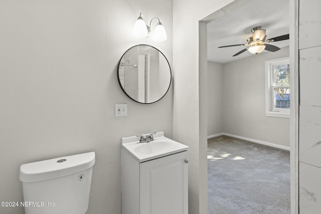 bathroom with ceiling fan, vanity, and toilet