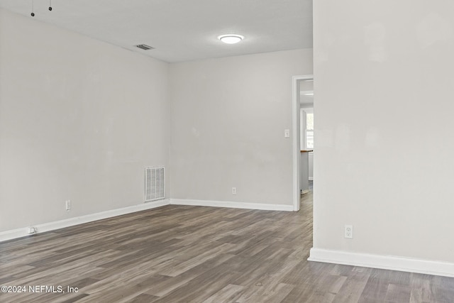 empty room featuring wood-type flooring