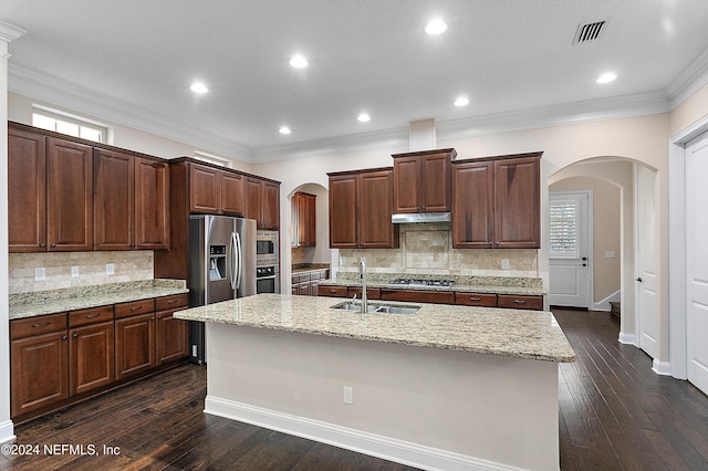 kitchen with stainless steel appliances, crown molding, sink, dark hardwood / wood-style floors, and an island with sink