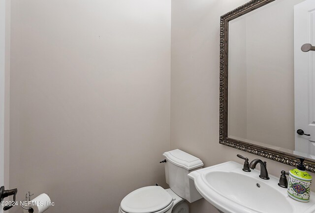 bathroom with toilet and sink