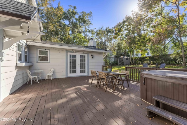 wooden deck featuring french doors and a hot tub