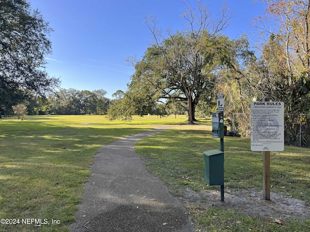 view of home's community with a yard