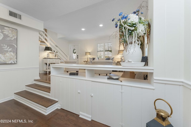 kitchen with a textured ceiling and dark hardwood / wood-style floors