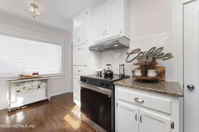 kitchen featuring ornamental molding, dark stone countertops, dark hardwood / wood-style floors, white cabinetry, and stainless steel range with electric cooktop