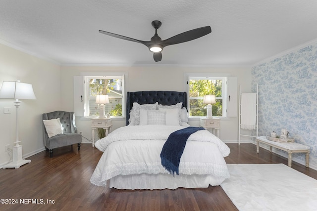 bedroom featuring multiple windows, ceiling fan, dark hardwood / wood-style flooring, and crown molding