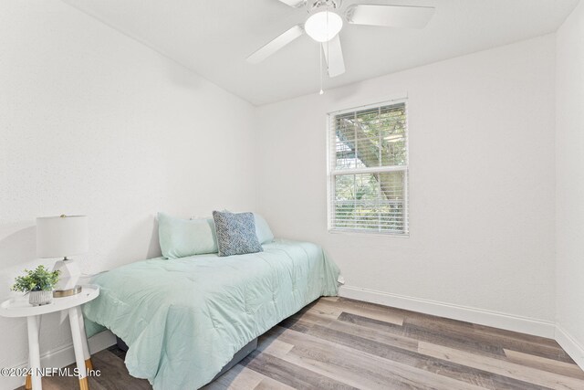 bedroom featuring light hardwood / wood-style flooring and ceiling fan