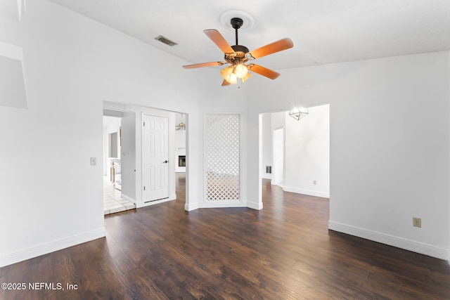 spare room featuring ceiling fan and dark hardwood / wood-style floors