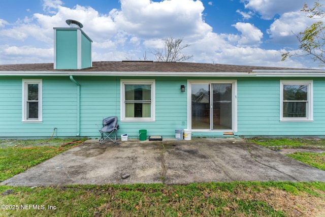 rear view of house with a patio