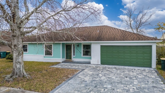 ranch-style home with a garage