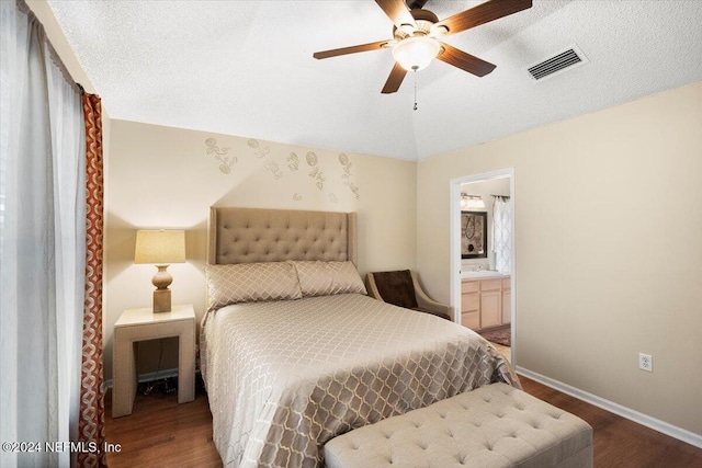 bedroom with hardwood / wood-style floors, ceiling fan, a textured ceiling, and ensuite bathroom