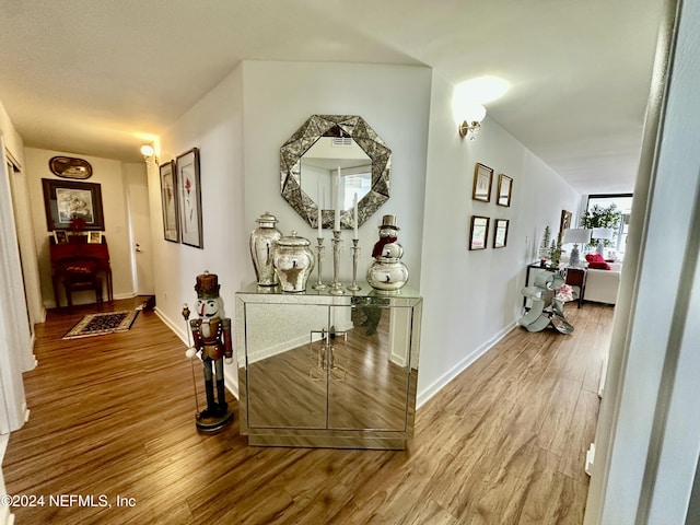 corridor featuring hardwood / wood-style flooring