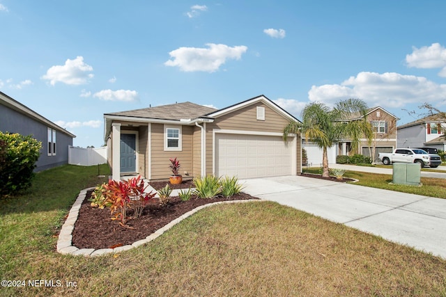 view of front of property with a front yard and a garage