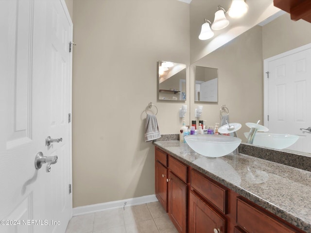 bathroom featuring tile patterned floors and vanity