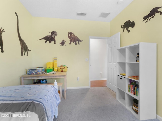 bedroom with light colored carpet