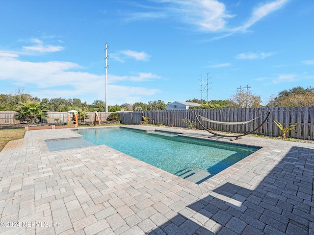 view of pool featuring a patio area