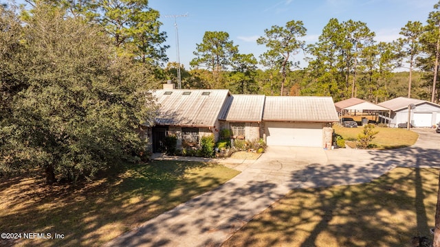 view of front facade featuring a front lawn and a garage