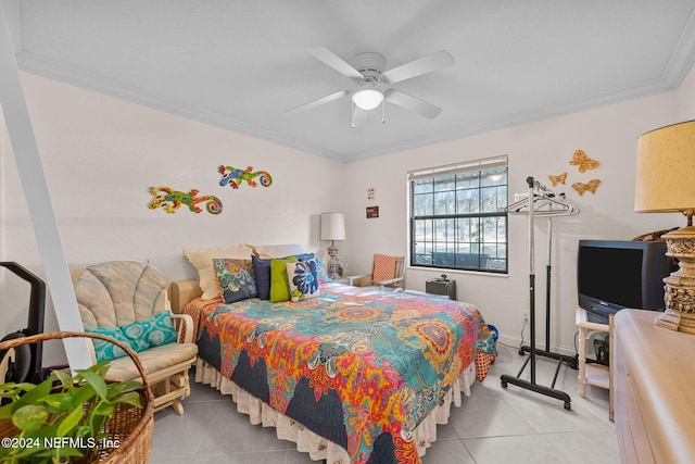 bedroom featuring ceiling fan, light tile patterned floors, and ornamental molding