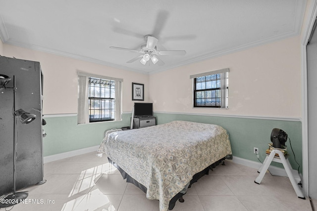 tiled bedroom featuring multiple windows, ceiling fan, and crown molding