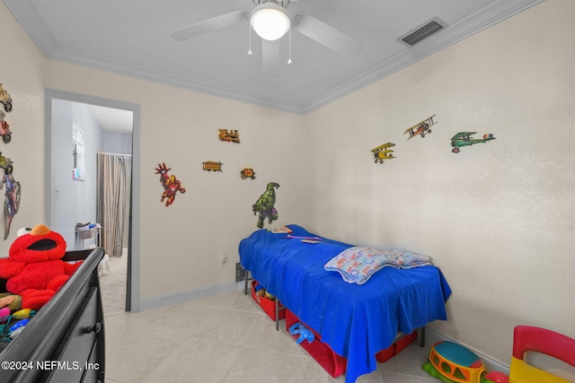 tiled bedroom featuring ceiling fan and crown molding