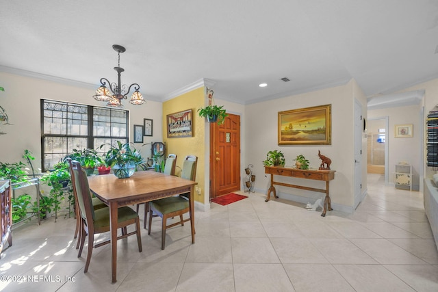 tiled dining space with a notable chandelier and ornamental molding