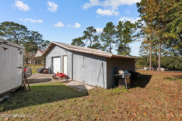 view of outdoor structure with a lawn