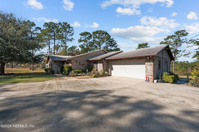 single story home featuring a garage