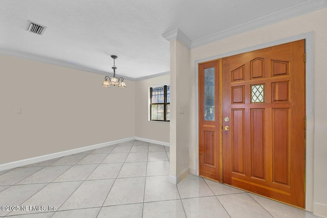 130 Jack Oak Dr, Melrose, FL 32666 - entryway featuring light tile patterned flooring, visible vents, baseboards, a chandelier, and crown molding