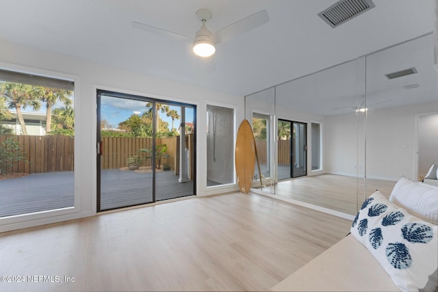 interior space featuring access to outside, ceiling fan, and light hardwood / wood-style floors