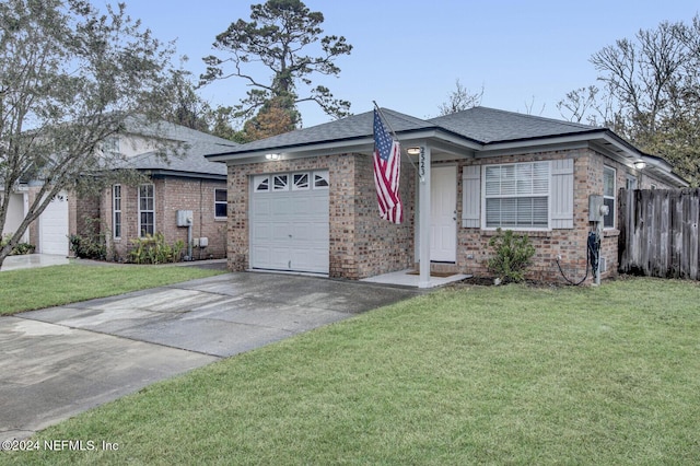 ranch-style home with a garage and a front lawn