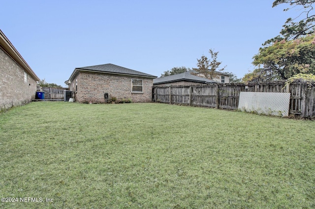 view of yard with central AC