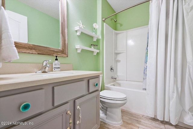 full bathroom featuring hardwood / wood-style floors, a textured ceiling, toilet, and shower / bath combo