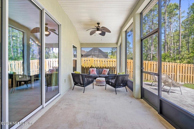 sunroom featuring vaulted ceiling and ceiling fan