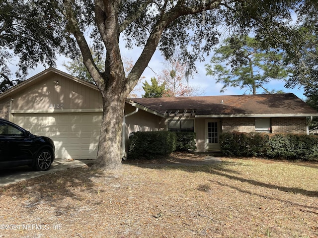 ranch-style home with a garage