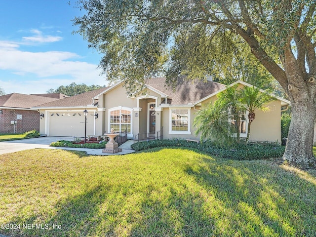 ranch-style home featuring a front lawn and a garage